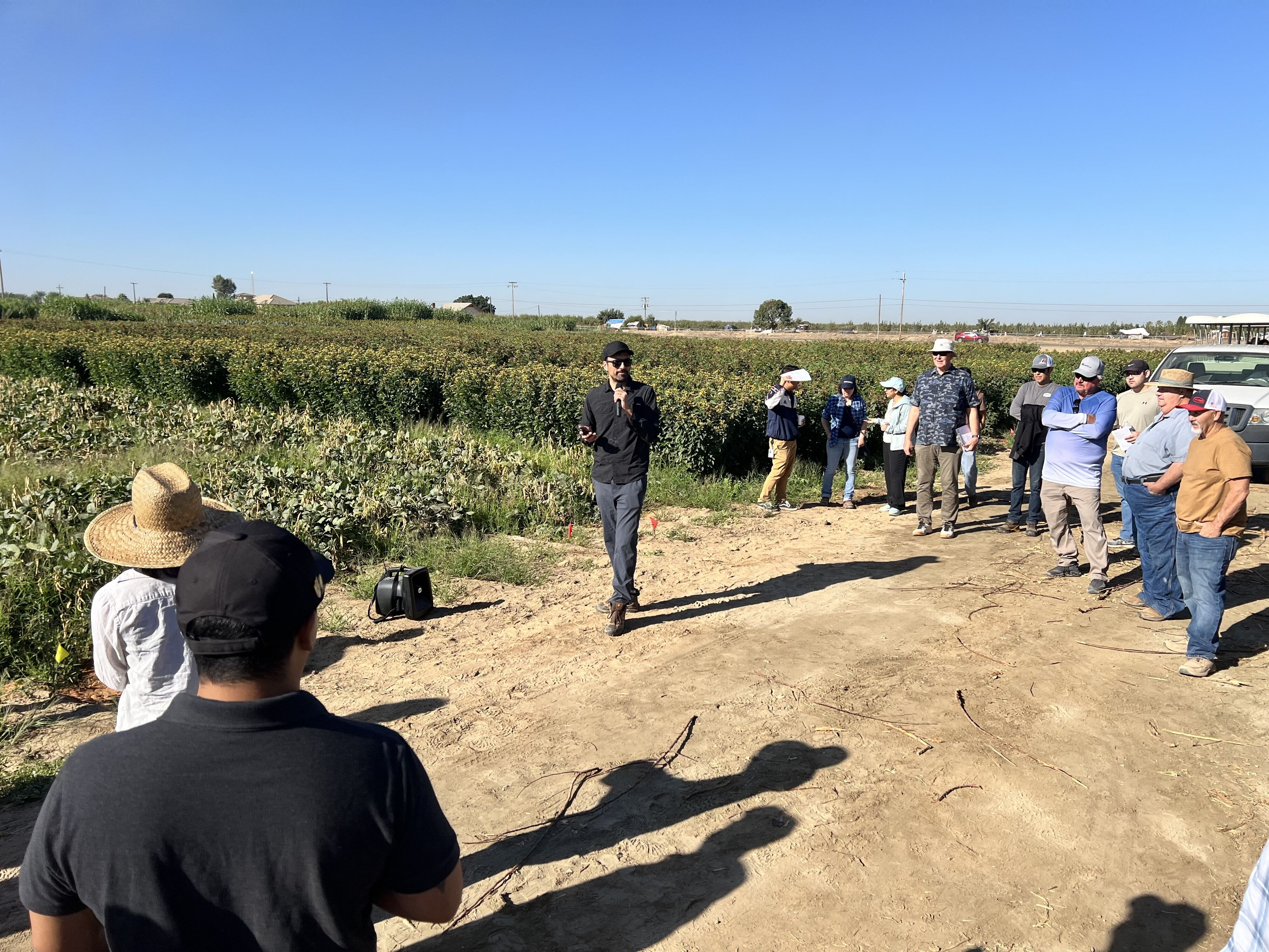 Field day attendees listen attentively to speaker