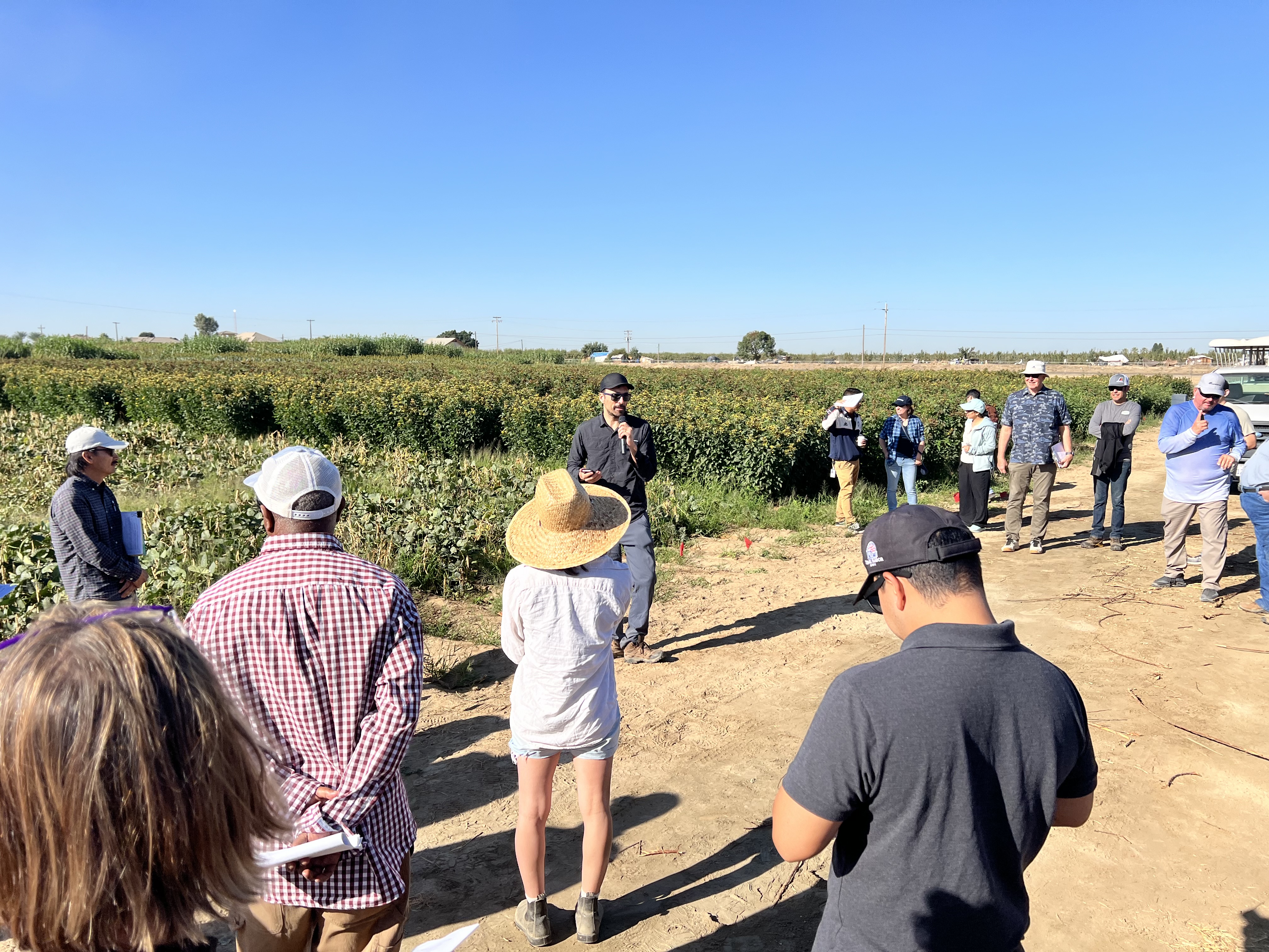 A crowd assembled around the field day presenter